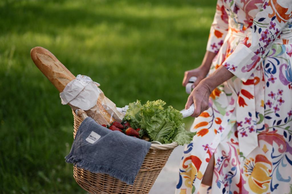 person with a bicycle basket with food