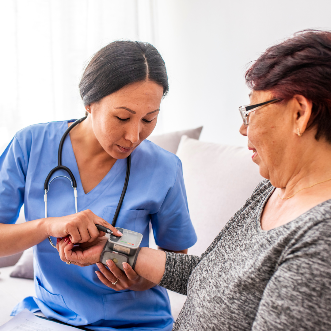 female doctor providing care to older female patient